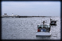 Lobsterboats in Winter by Cape Porpoise Light in Maine